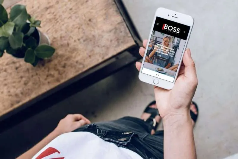 One of T&C SOLUTIONS PTE. LTD.'s clients looking at the website we built for them on their phone