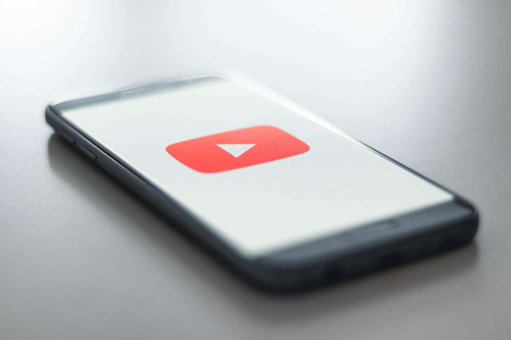Phone with the YouTube logo on screen