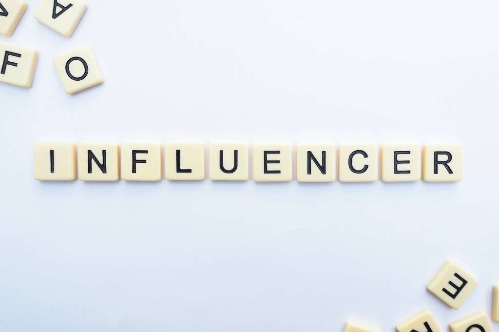 Scrabble tiles spelling Influencer