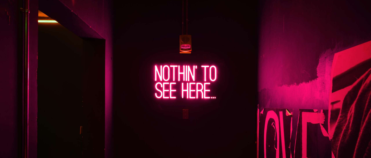 A neon sign that says 'Nothing to See Here'